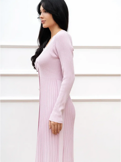 Elegant pink midi dress featuring ribbed texture and a flattering fit, perfect for wedding guest or formal occasions.