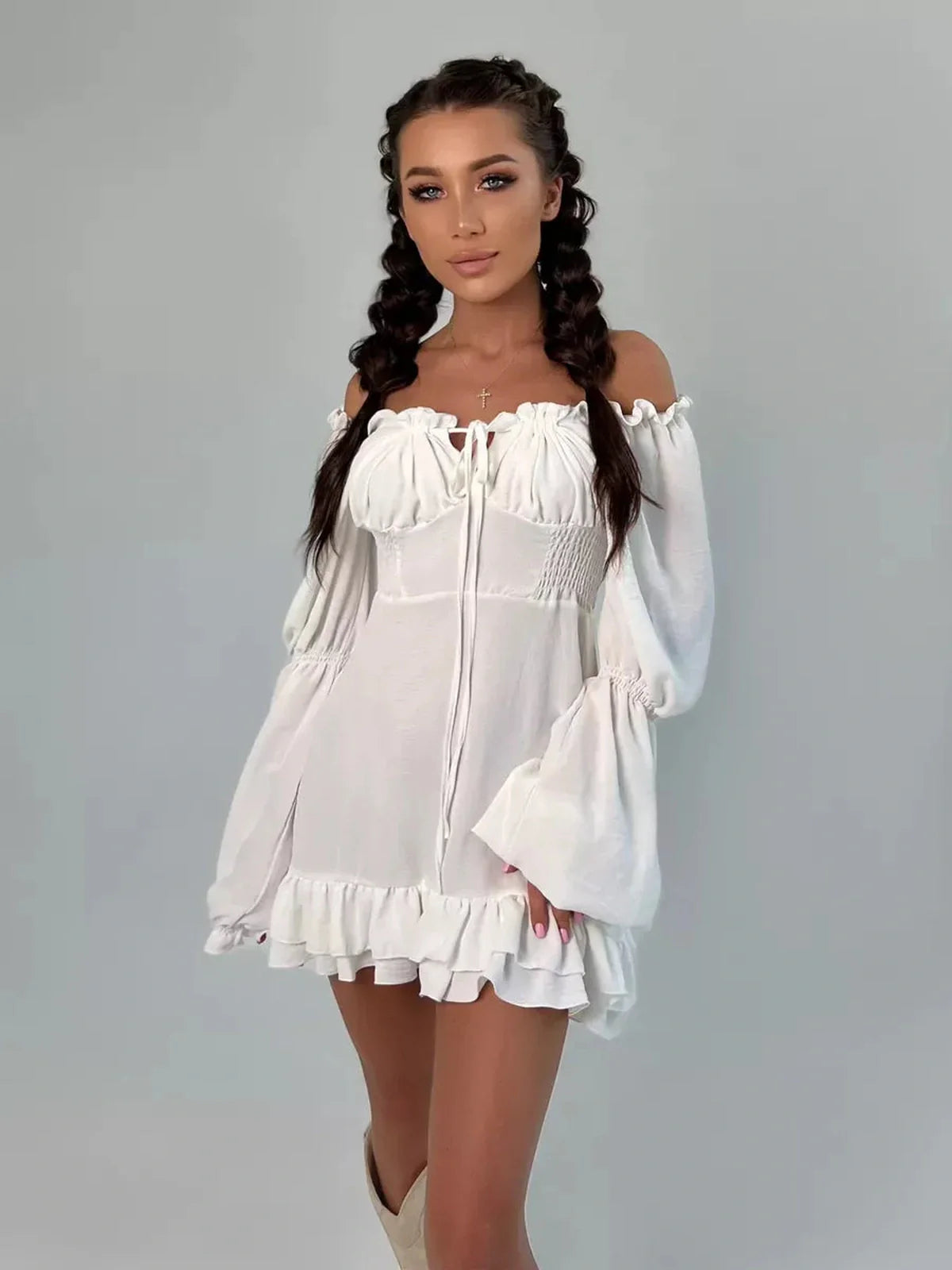 Ruffle Bloom Mini Dress in white, featuring off-shoulder design, voluminous sleeves, and flirty ruffles for a stylish summer look.