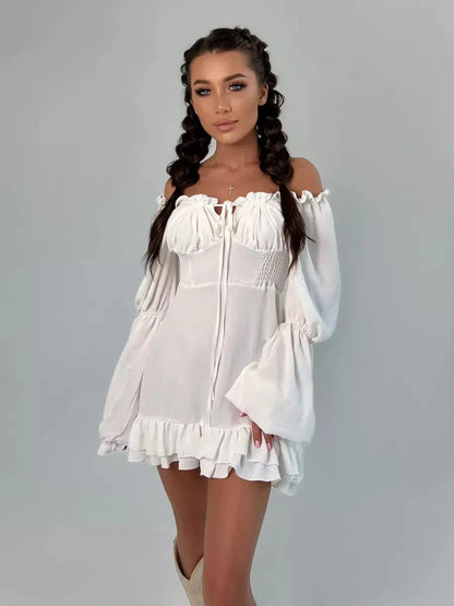 Ruffle Bloom Mini Dress in white, featuring off-shoulder design, voluminous sleeves, and flirty ruffles for a stylish summer look.