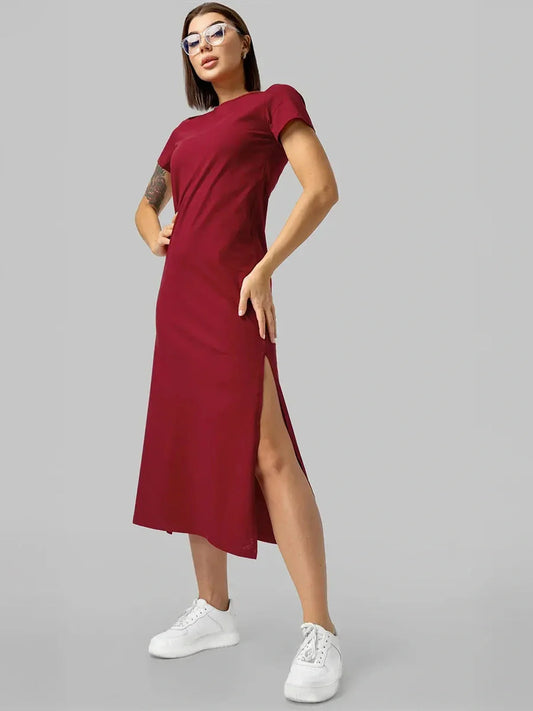 Model wearing an essential cotton midi dress in burgundy, perfect for summer events and everyday wear.