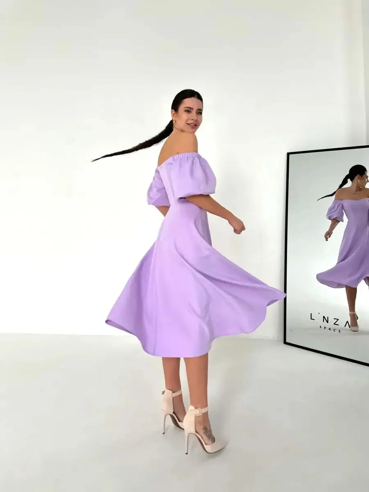 Lilac Grace Midi Dress with off-shoulder puff sleeves, perfect for summer weddings and casual events.