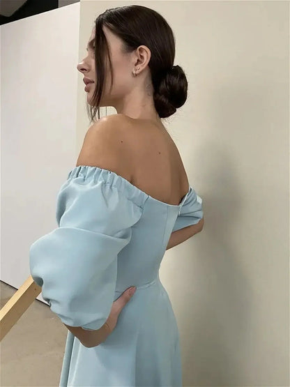 Off-shoulder Serenity Midi Dress showcasing a mint-blue hue and voluminous sleeves, perfect for weddings and special occasions.