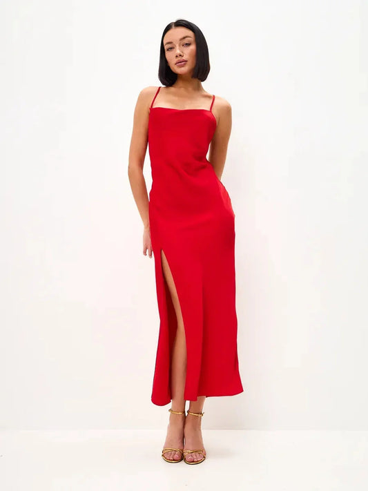 Scarlet Glow Midi Dress featuring a strappy silhouette, side slit, and open back, perfect for weddings and formal events.