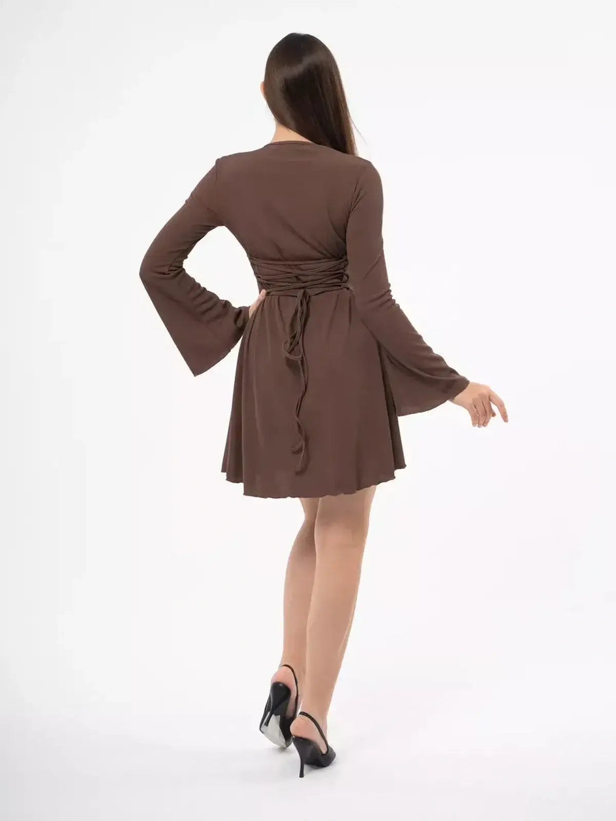 Back view of Cocoa Tie Mini Dress with flared sleeves and lace-up detail, perfect for wedding or casual wear.