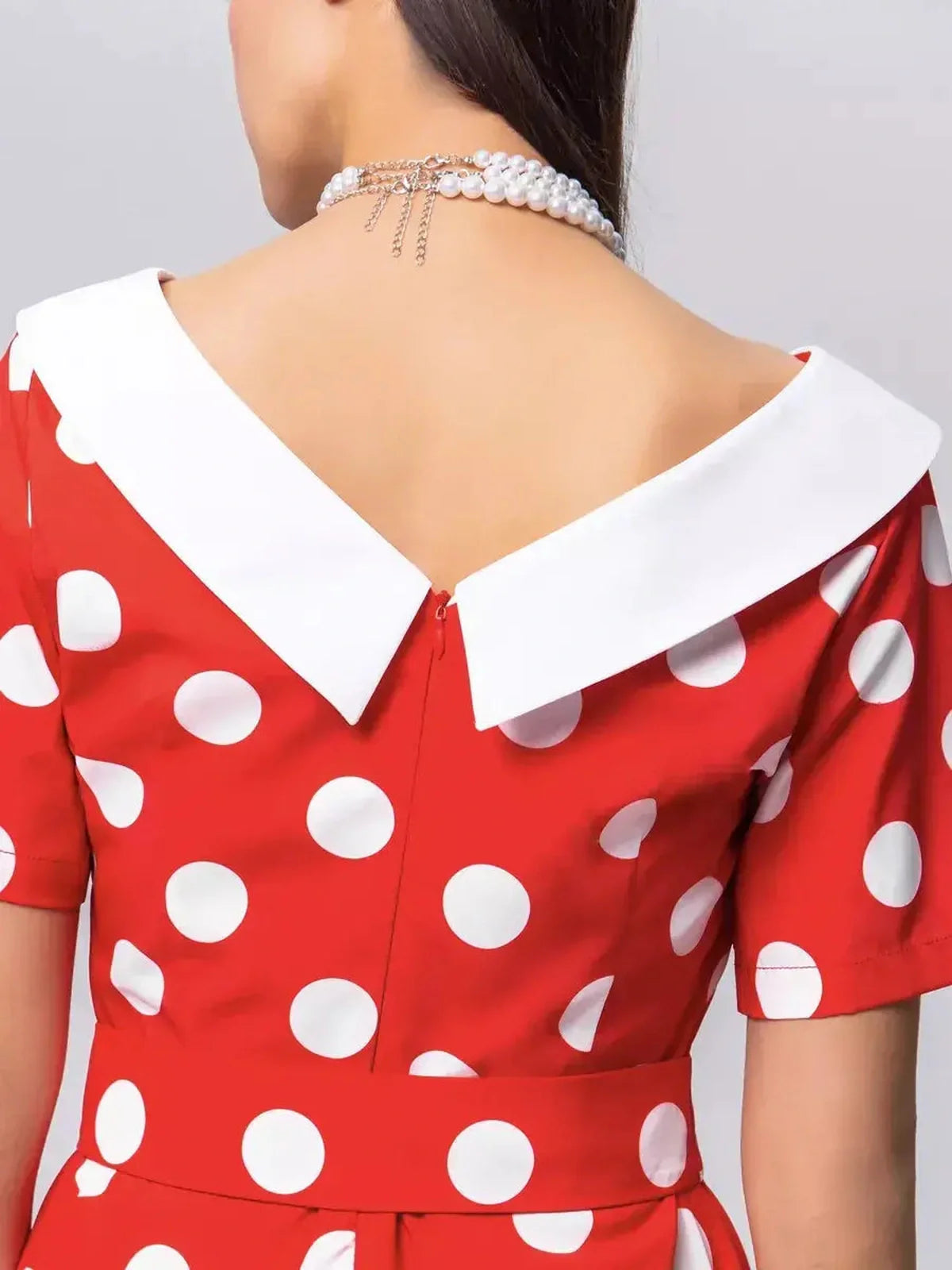 Back view of the Retro Charm Midi Dress featuring a white collar and red polka dot pattern, ideal for summer and wedding guest attire.