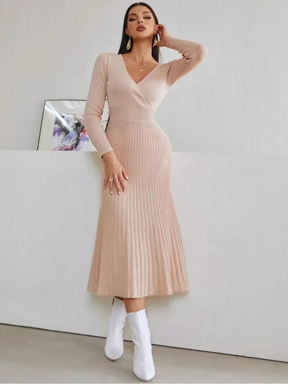 Blush Grace Midi Dress in soft pink, featuring a wrap-effect bodice and pleated skirt, perfect for weddings or formal occasions.