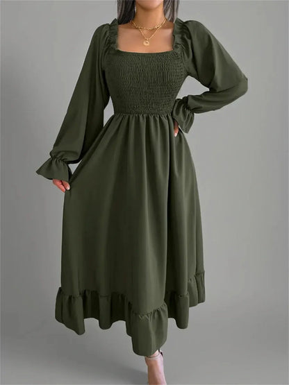 Ruffle Charm Midi Dress in olive green, featuring a smocked bodice and long sleeves, perfect for weddings and casual outings.
