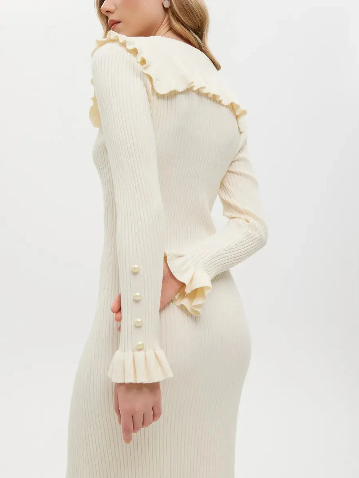 Elegant Pearl Ruffle Midi Dress showcasing a soft knit, romantic flounce collar, and pearl button details.