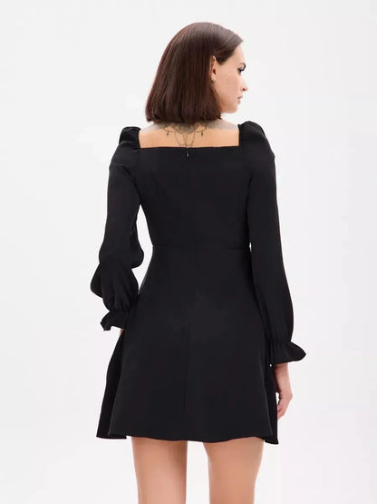 Back view of the Midnight Frame Mini Dress featuring structured sleeves and a flattering square neckline.