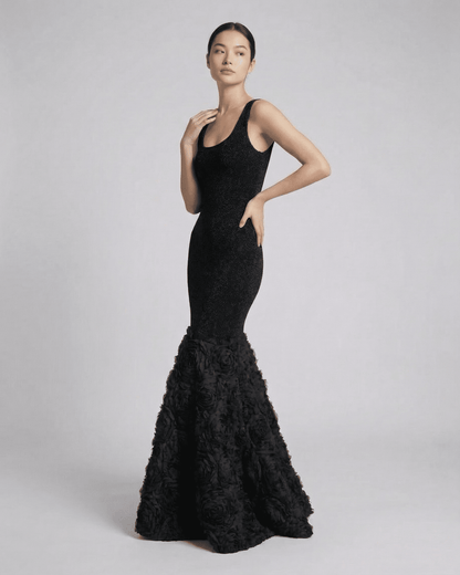 Elegant Nocturne Maxi Dress by Slimona featuring a sculpted silhouette and textured hem detail in black.