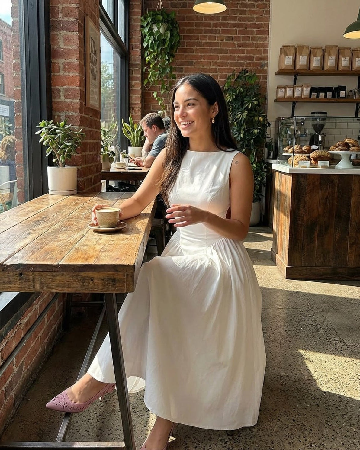 Elysia Midi Dress by Slimona, elegant A-line midi dress showcased in a cozy cafe setting.