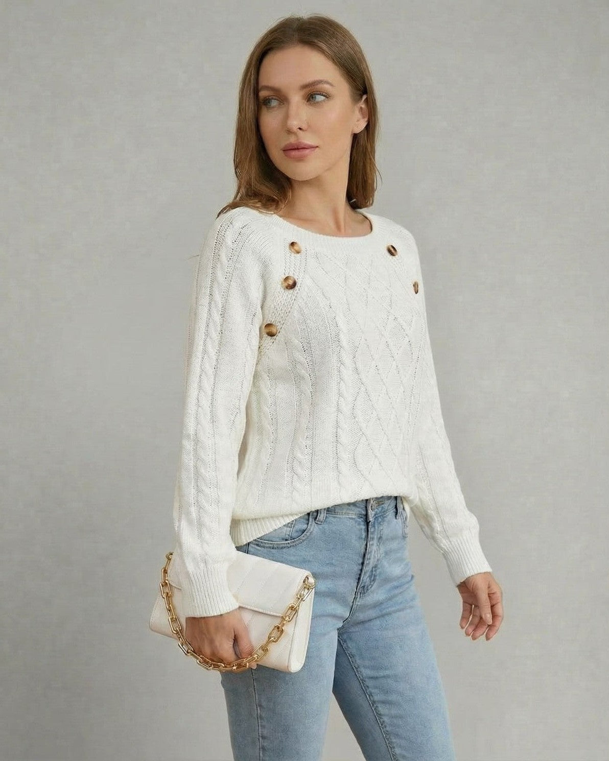 Luna Pullover by Slimona, featuring a cable knit texture and square collar, styled with a chic handbag.