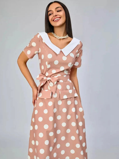 Vintage Muse Midi Dress featuring a polka dot pattern and white collar detail, perfect for summer occasions.