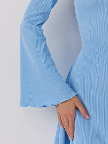 Elegant blue mini dress detail featuring a chic flared sleeve design, perfect for summer and formal occasions.