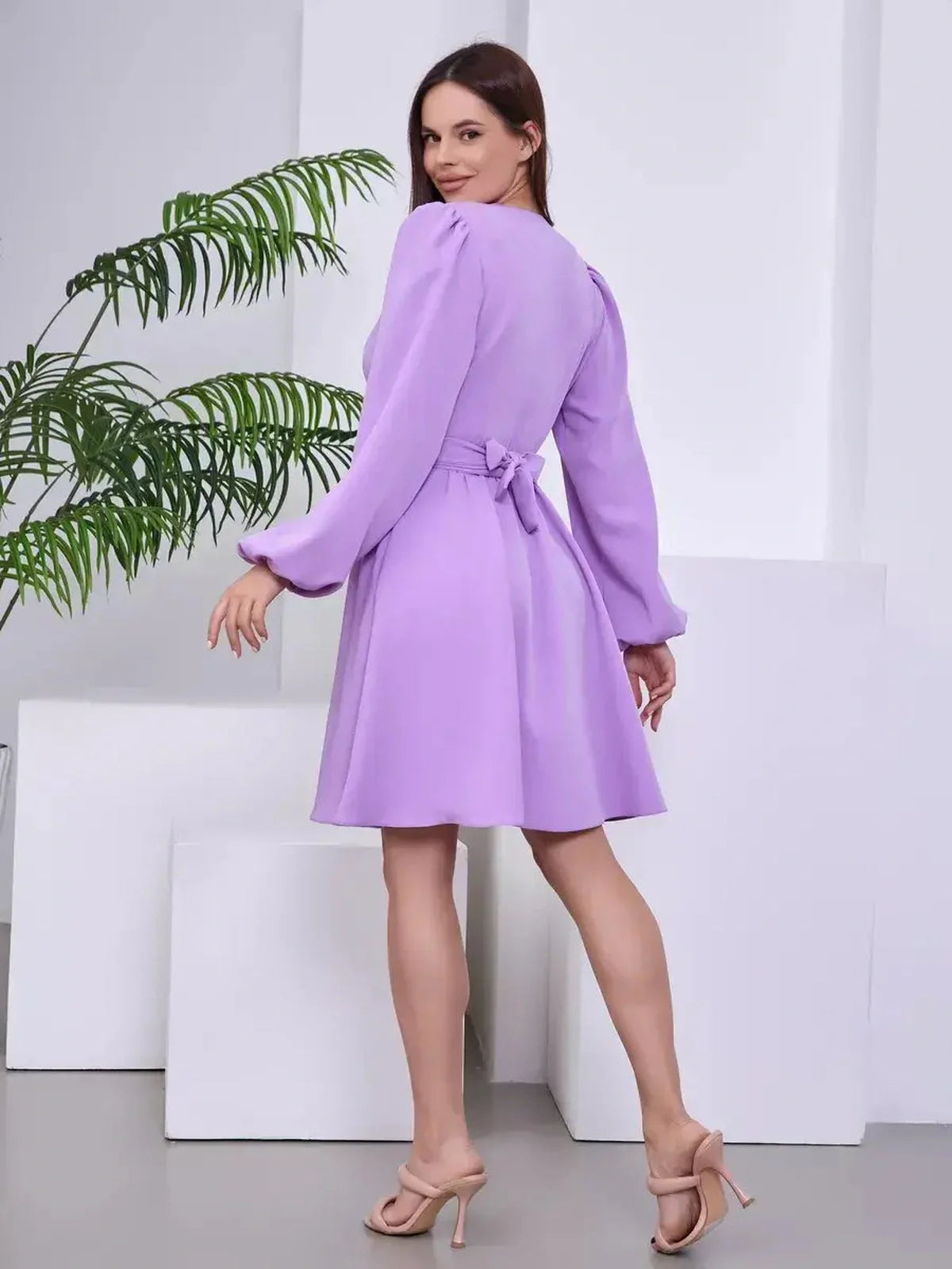 Lilac Whisper long sleeve dress with a flattering fit and matching belt, perfect for weddings and formal events.