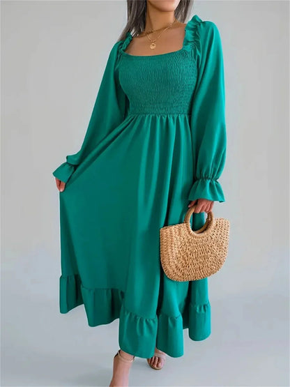 Meadow Ruffle Midi Dress in rich green, featuring a smocked bodice and flowing skirt, perfect for summer and special occasions.