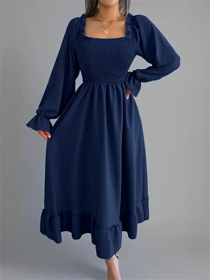 Midnight Charm Midi Dress in navy blue with smocked bodice and flounce hem, perfect for weddings and summer events.