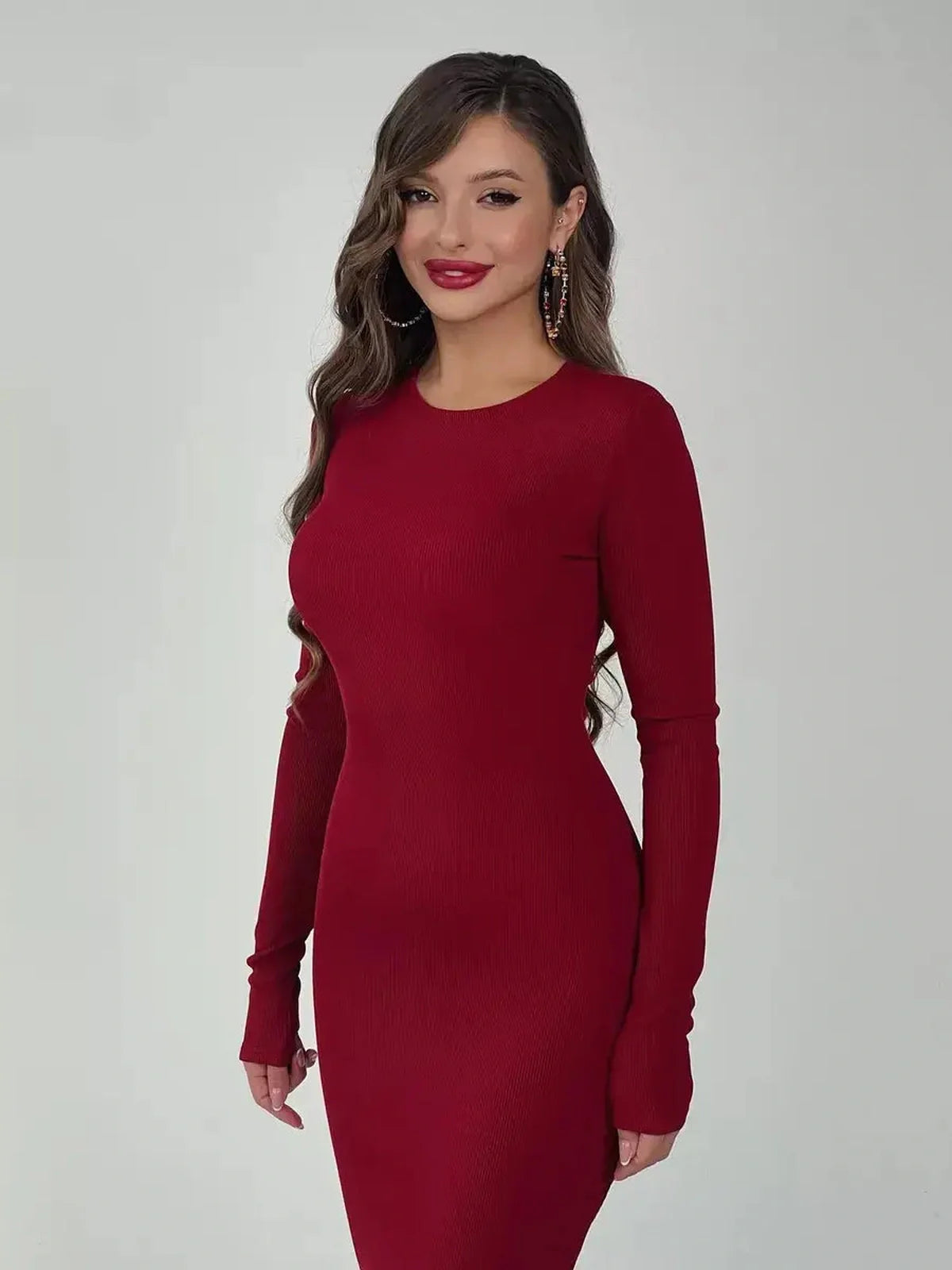 Velvet Ember Maxi Dress in rich burgundy, featuring a sleek silhouette and long sleeves, ideal for weddings and formal events.