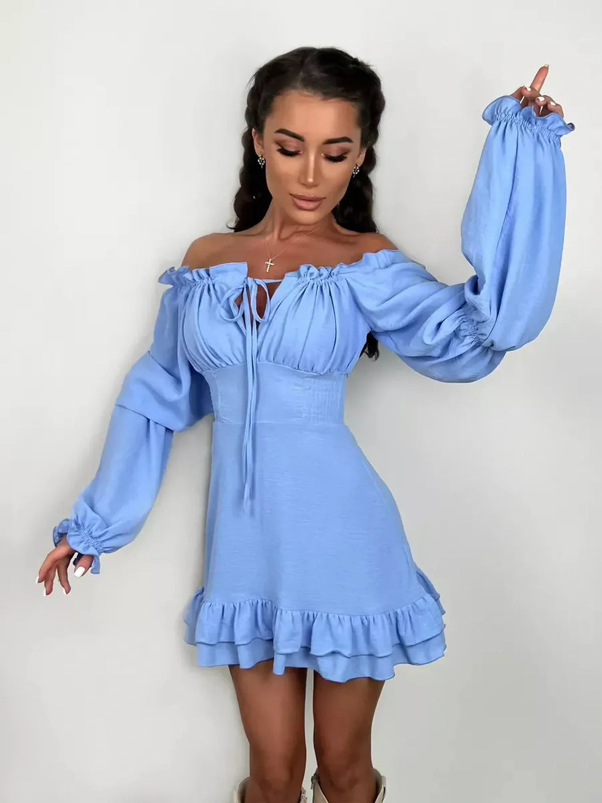 Sky-blue boho frill mini dress featuring off-shoulder neckline, romantic ruffle detail, perfect for summer weddings and parties.