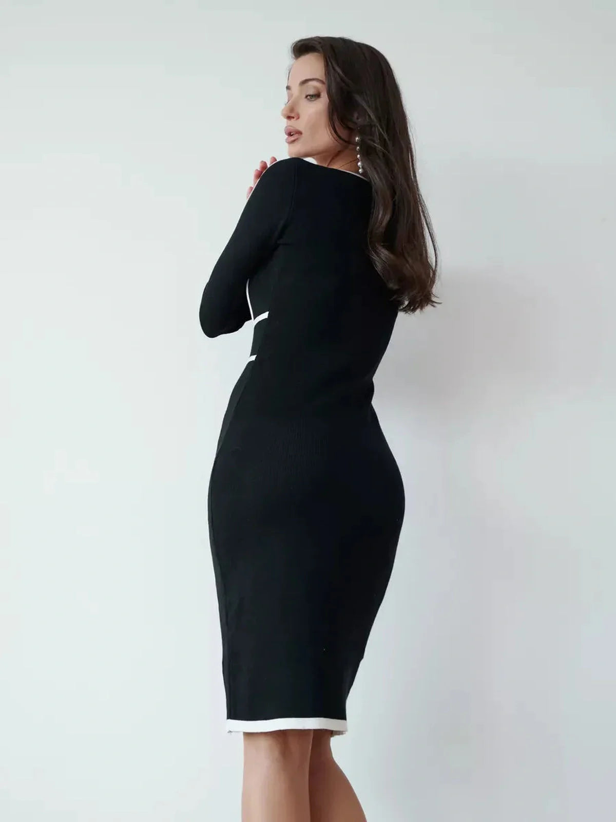Elegant Frame Midi Dress in black with white trim, perfect for cocktail parties, weddings, and formal occasions.