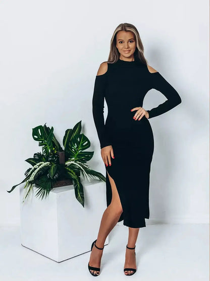 Model wearing a sleek black shadow midi dress with cutout shoulders and side slits, styled for an elegant look.