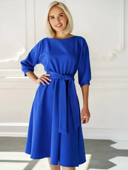 Sapphire belted midi dress featuring a sleek A-line silhouette, structured boat neckline, and a waist-defining belt.
