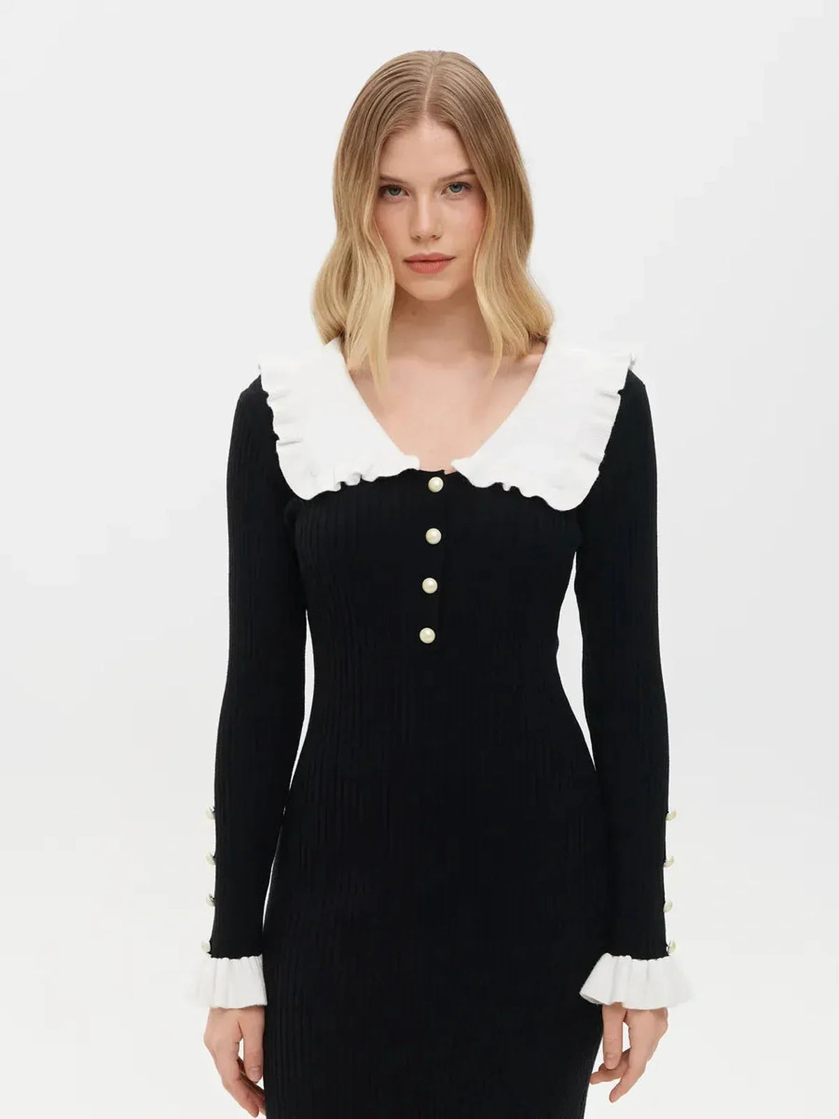 Elegant black midi dress with a ruffle collar and white pearl details, perfect for weddings and formal occasions.