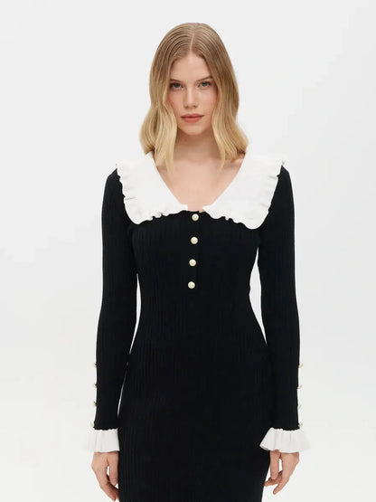 Elegant black midi dress with a ruffle collar and white pearl details, perfect for weddings and formal occasions.