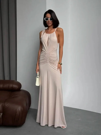 Elegant Serene Curve Maxi Dress in soft beige with ruched detailing, perfect for summer occasions, weddings, and formal events.