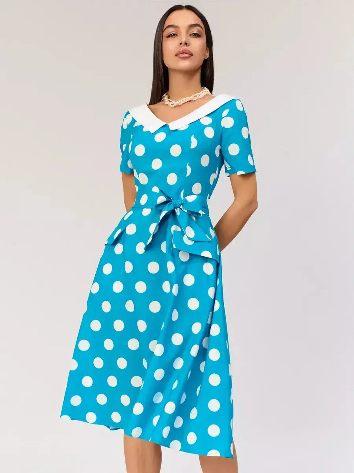Retro Charm Midi Dress in turquoise with white polka dots and contrast collar, perfect for summer events and stylish occasions.