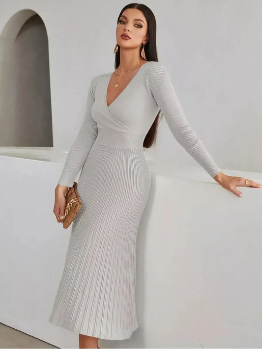 Sculpted Grace Midi Dress in light gray with ribbed texture, featuring a V-neckline and pleated skirt, perfect for weddings.