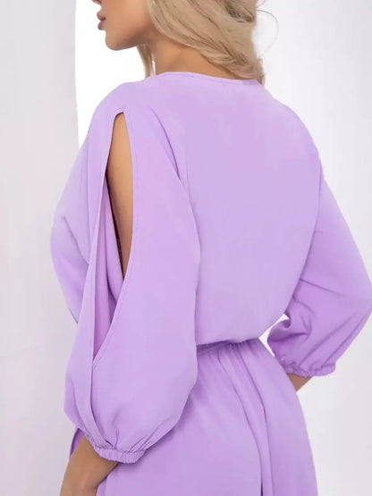Back view of a Luxe Lilac Midi Dress featuring elegant shoulder cutouts and a belted waist for a stylish silhouette.