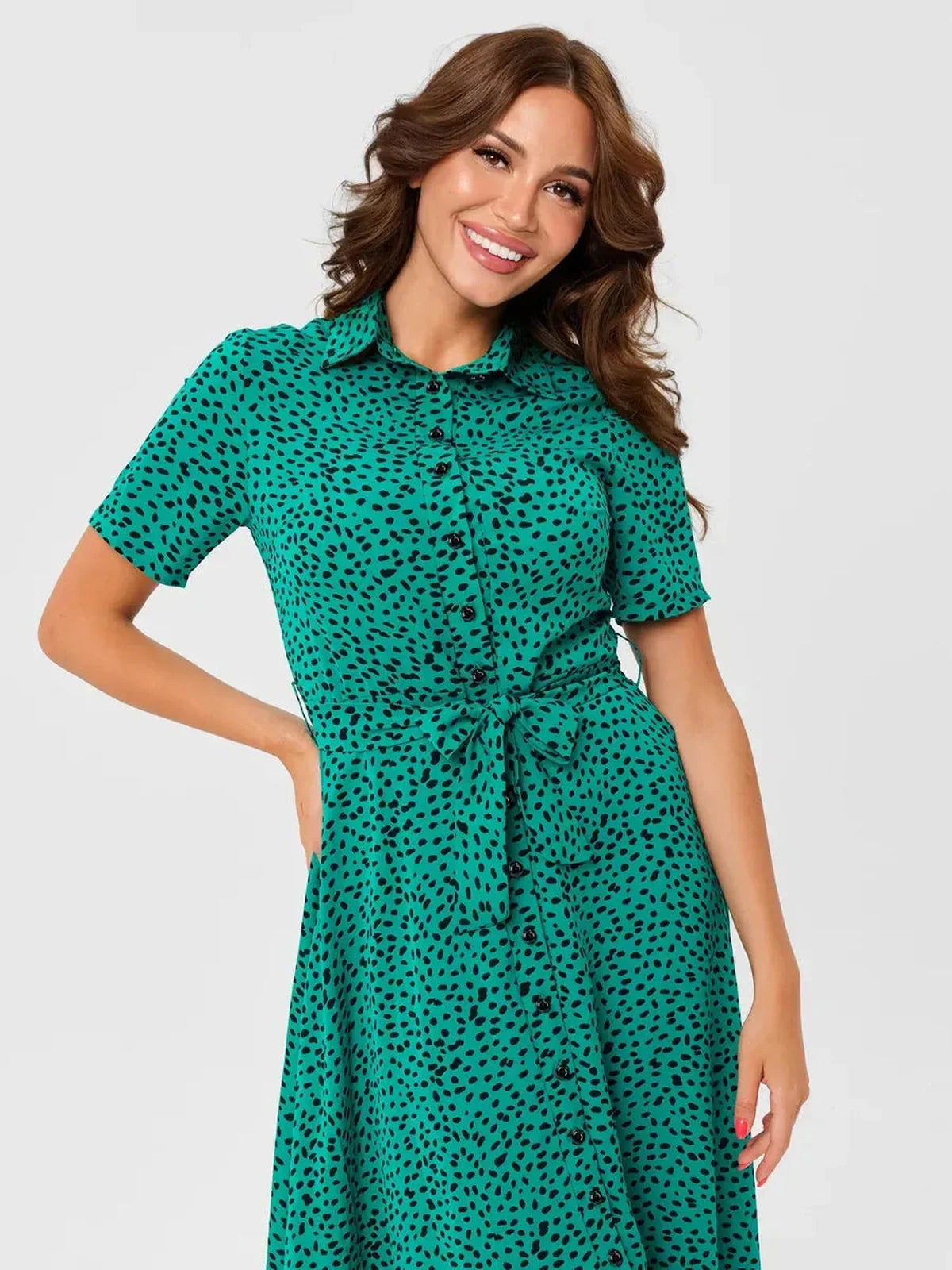 Jade Petal Midi Dress featuring a vibrant green color, short sleeves, V-neckline, button front, and self-tie belt for summer elegance.