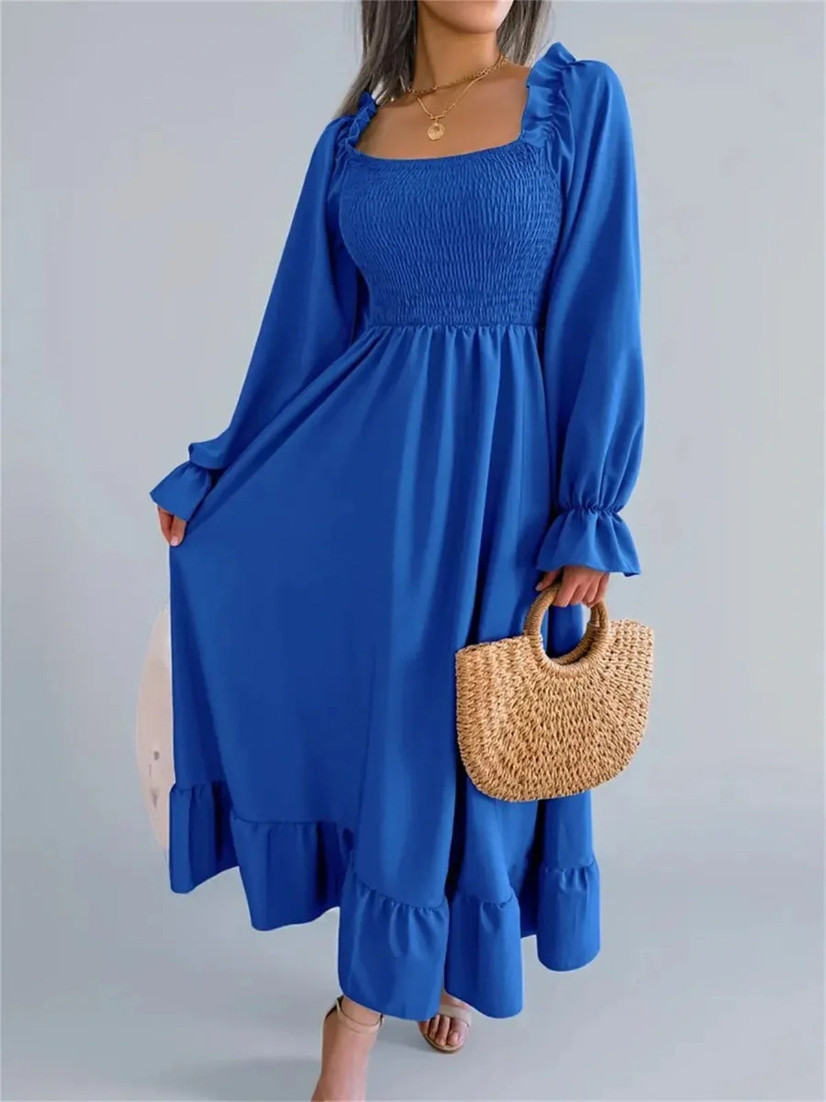 Serena Midi Dress in vibrant blue with smocked bodice and ruffle details, perfect for weddings or casual summer outings.