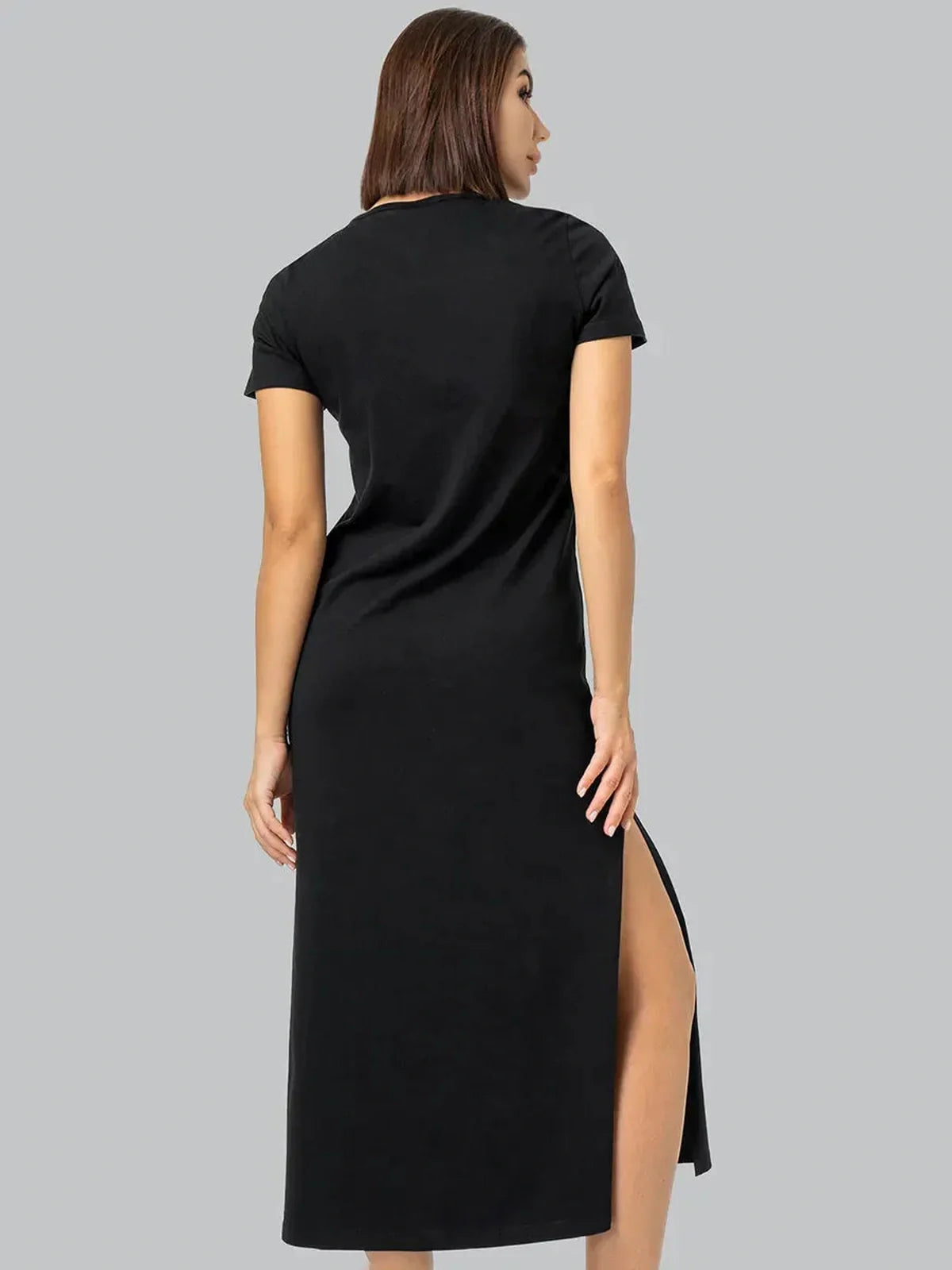 Back view of essential black midi dress with sleek side slit, perfect for casual or formal occasions.