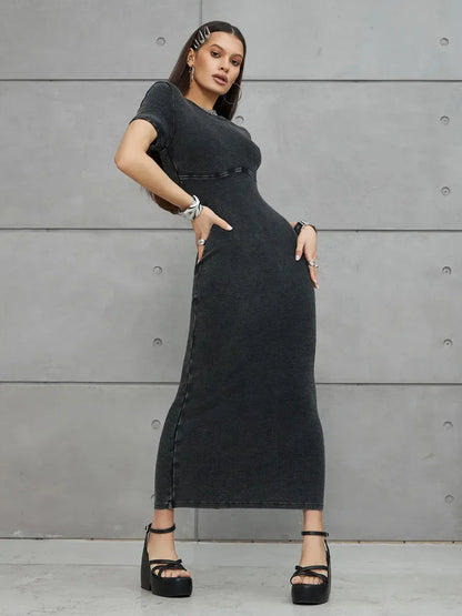 Graphite Form Maxi Dress on model showcasing sleek fit and urban style, perfect for summer or formal occasions.