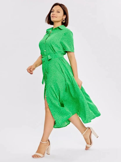 Bright green midi dress featuring white dots, button-down style, tie waist, and flowing A-line cut for women.