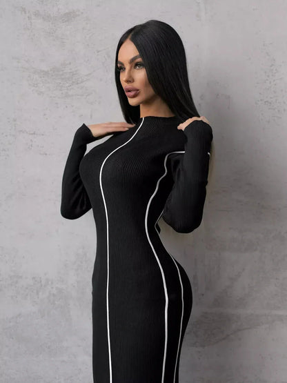 Elegant black midi dress with white contour stripes, perfect for formal events, weddings, or as a chic cocktail dress.