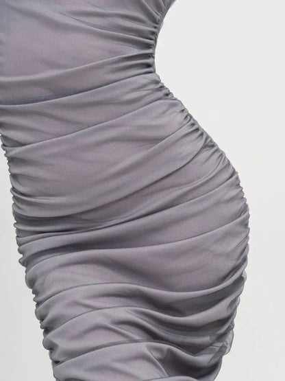 Detail of the Sculpted Sheer Midi Dress featuring elegant ruching design and soft mesh fabric for a flattering silhouette.