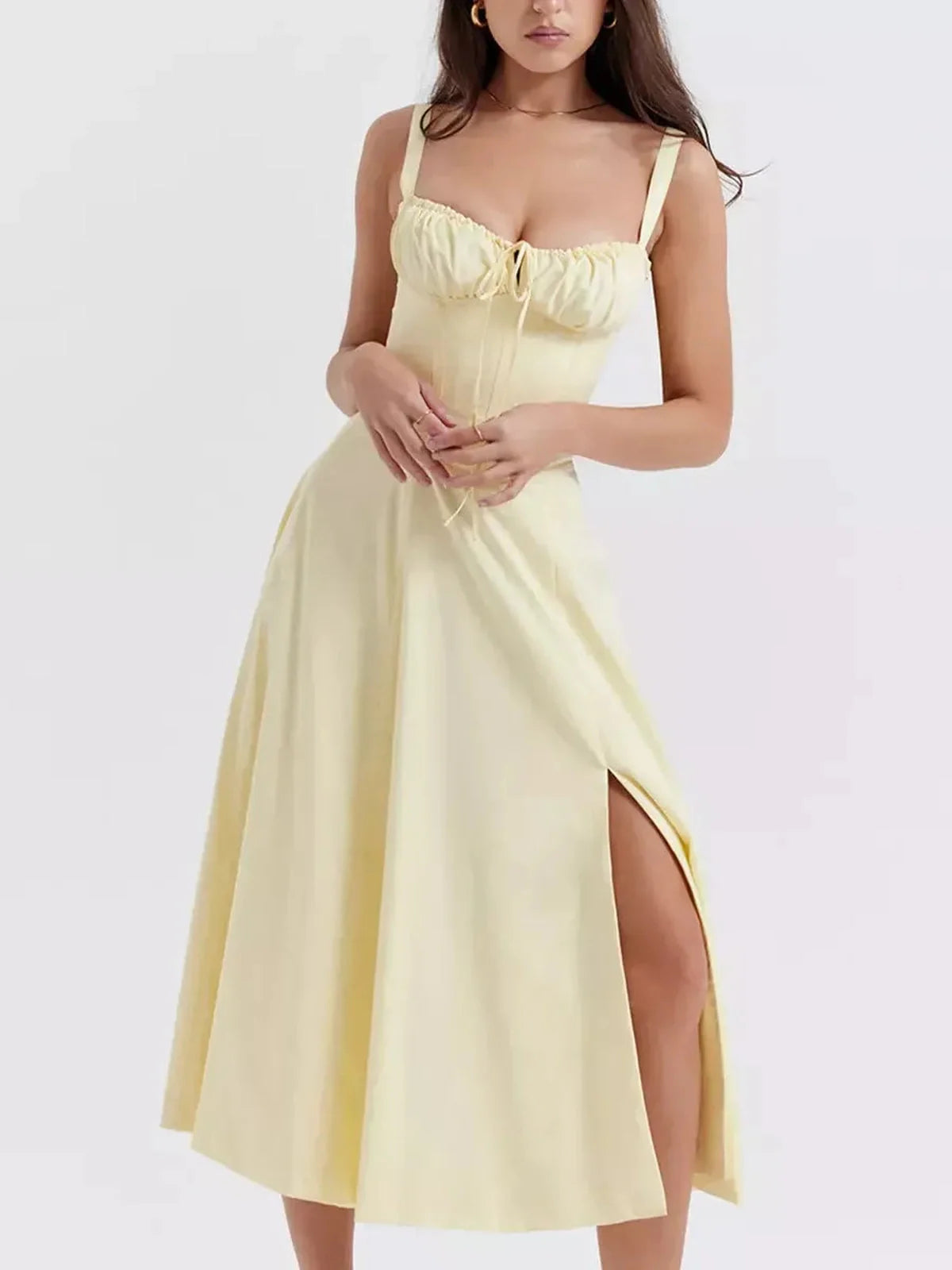 Sunlace Midi Dress in soft yellow featuring a bustier corset detail and flowing A-line skirt, perfect for summer occasions.