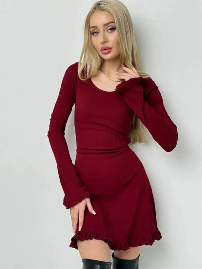 Crimson Flare red mini dress with romantic ruffles, fitted silhouette, and ribbed knit fabric, perfect for weddings or parties.