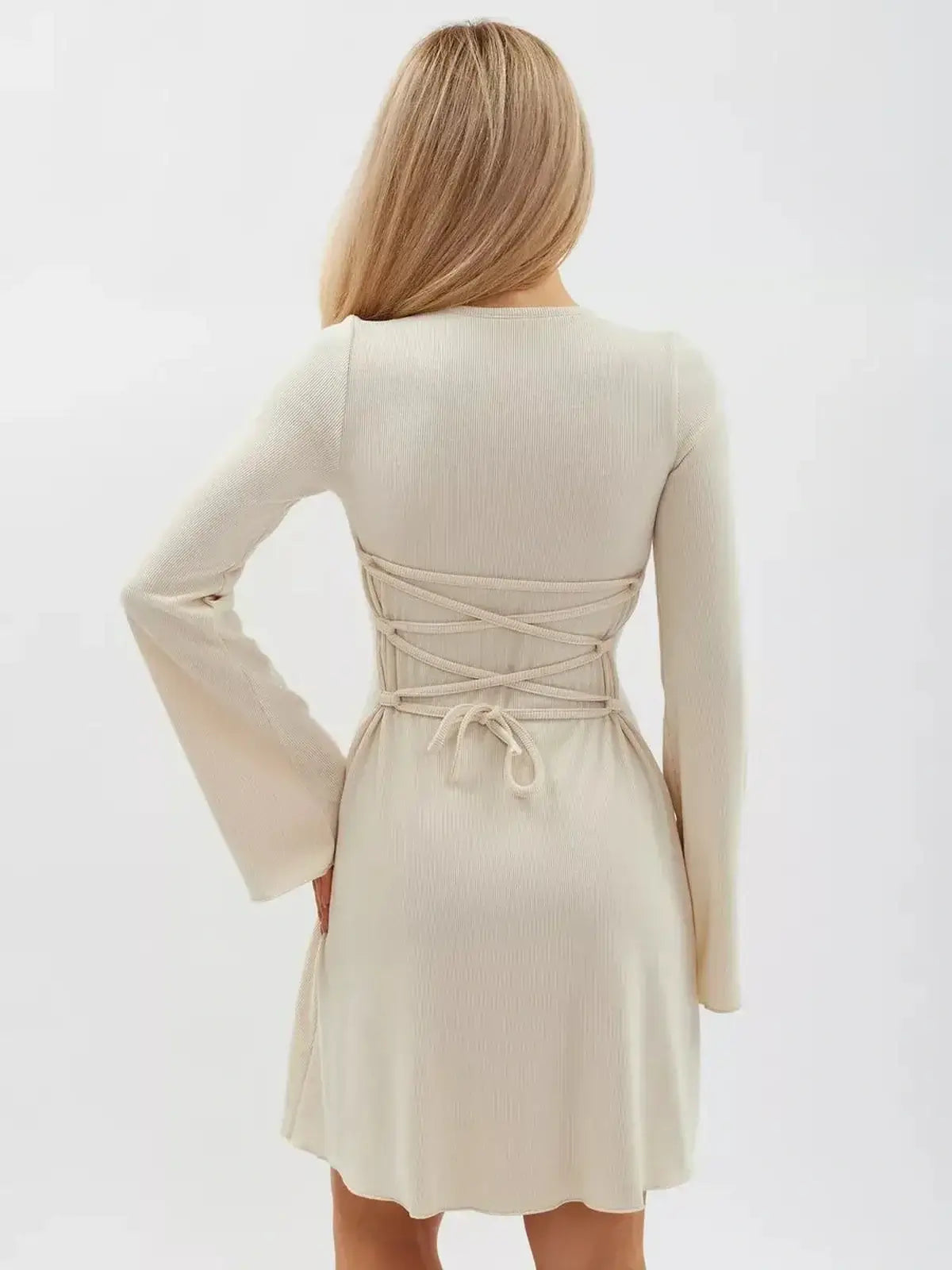 Back view of the Vanilla Flare Mini Dress with flared sleeves and waist-defining back tie, ideal for summer occasions.