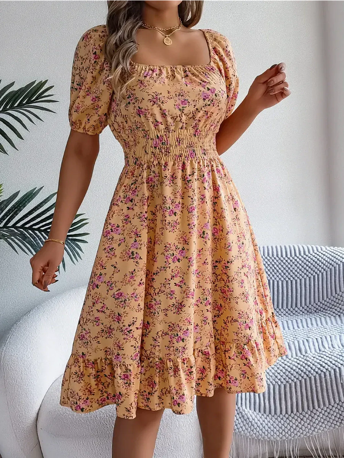Marigold Bloom floral midi dress with puff sleeves, smocked waist, and ruffle hem, perfect for summer occasions.