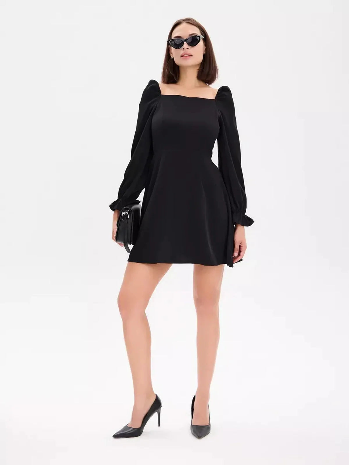 Chic Midnight Frame Mini Dress featuring a square neckline and puffed sleeves, perfect for weddings or cocktail events.