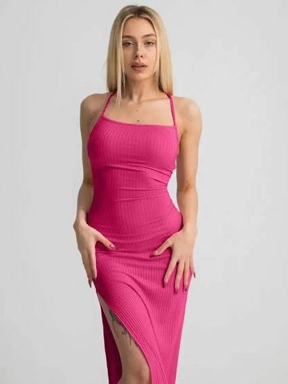 Lush Lace Midi Dress in vibrant pink, featuring a strappy bodycon fit and thigh-high side slit, ideal for summer events.