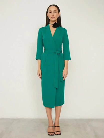 Emerald green Sculpted Grace Midi Dress featuring a belted waist and elegant wrap-style front, perfect for evening occasions.