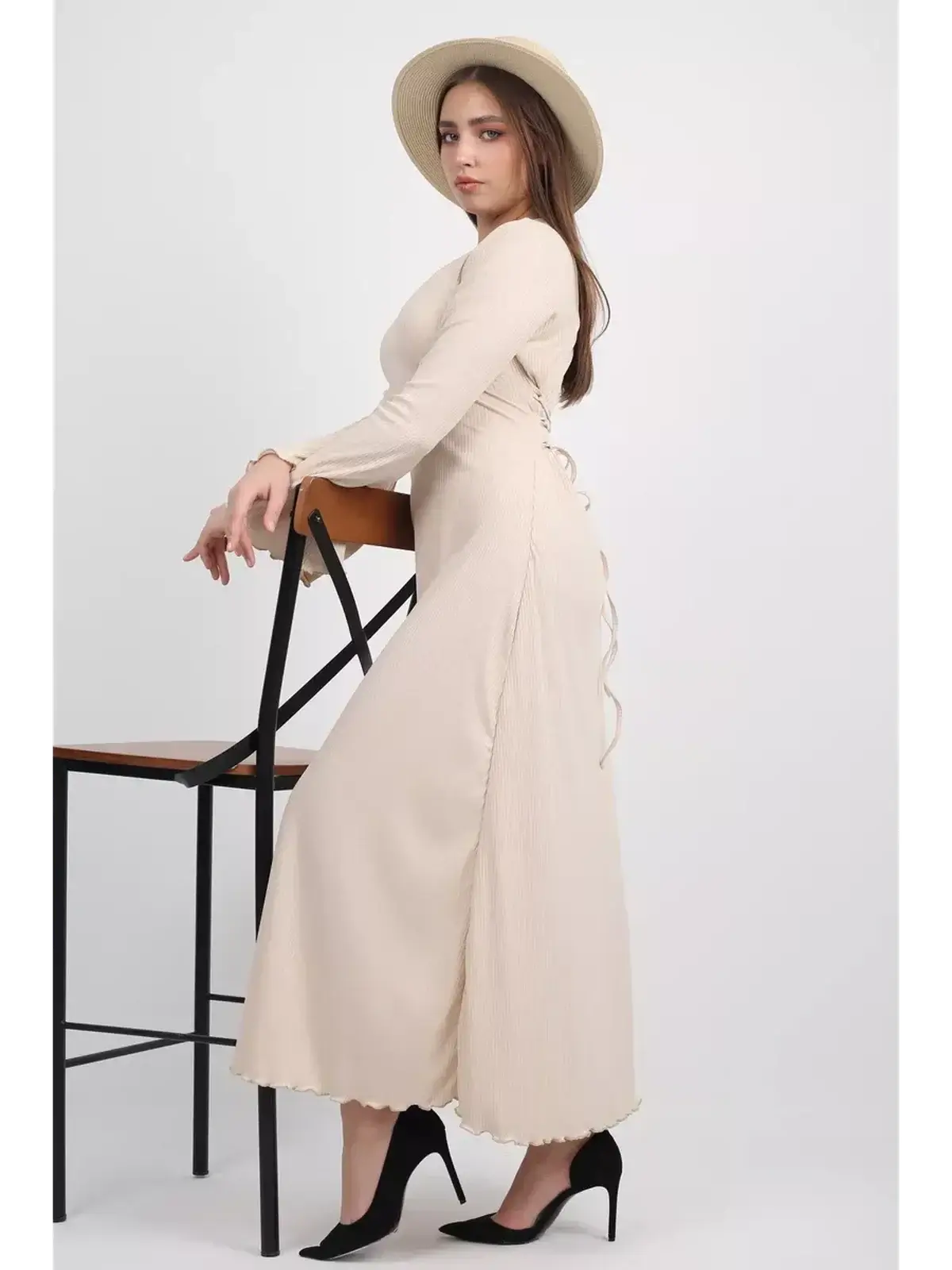 Ivory Flow Midi Dress featuring a sculpted silhouette, flared sleeves, and luxe texture, perfect for weddings and formal events.