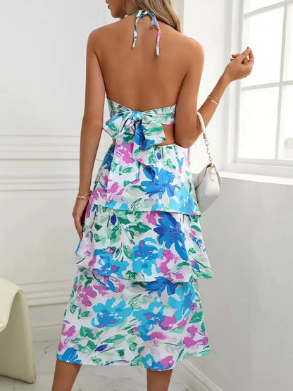 Back view of Petal Bloom Midi Dress featuring vibrant floral print, perfect for summer weddings and special occasions.