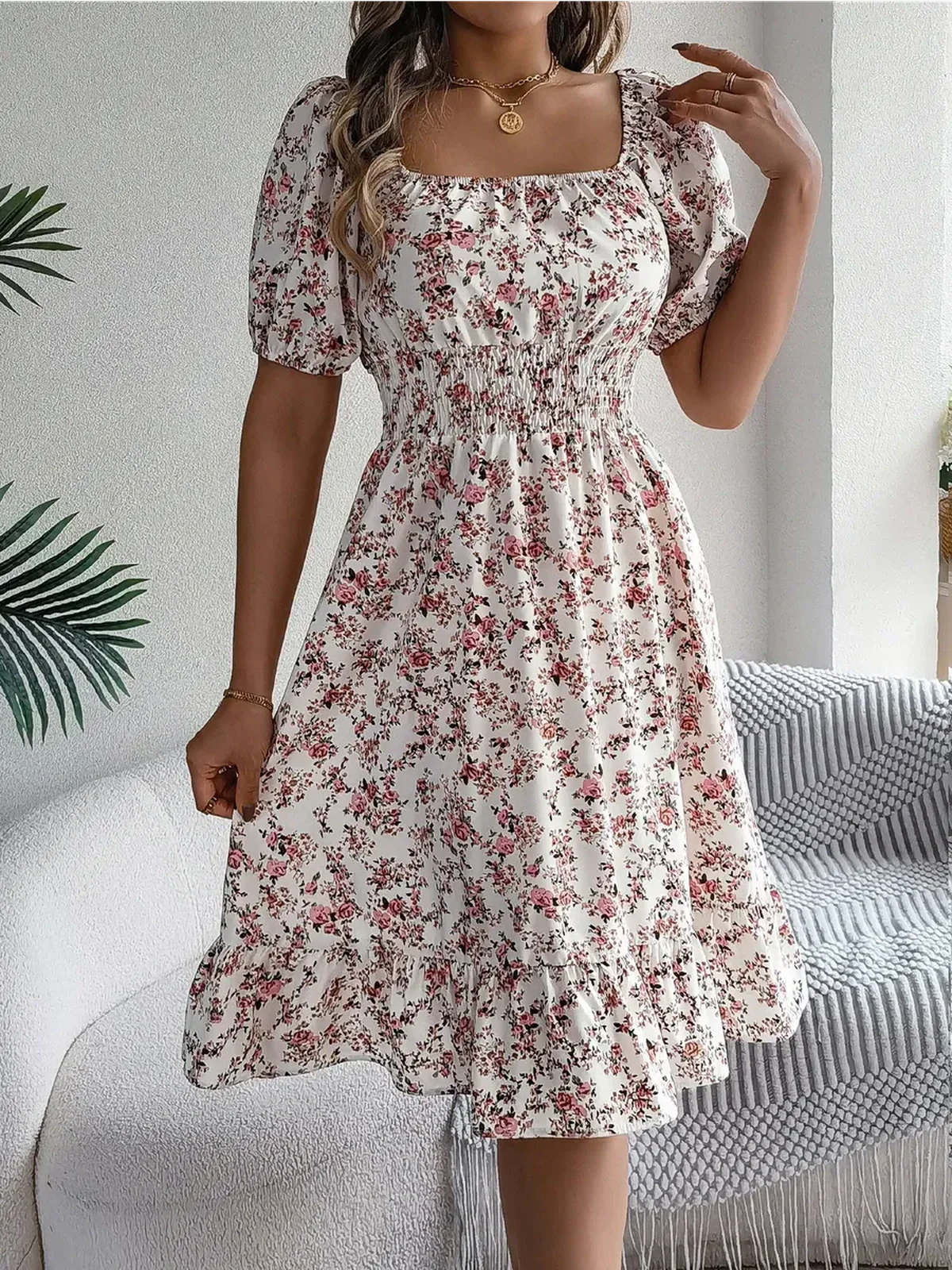 Floral mini dress with square neckline, puff sleeves, and ruffle hem, perfect for summer weddings and casual outings.