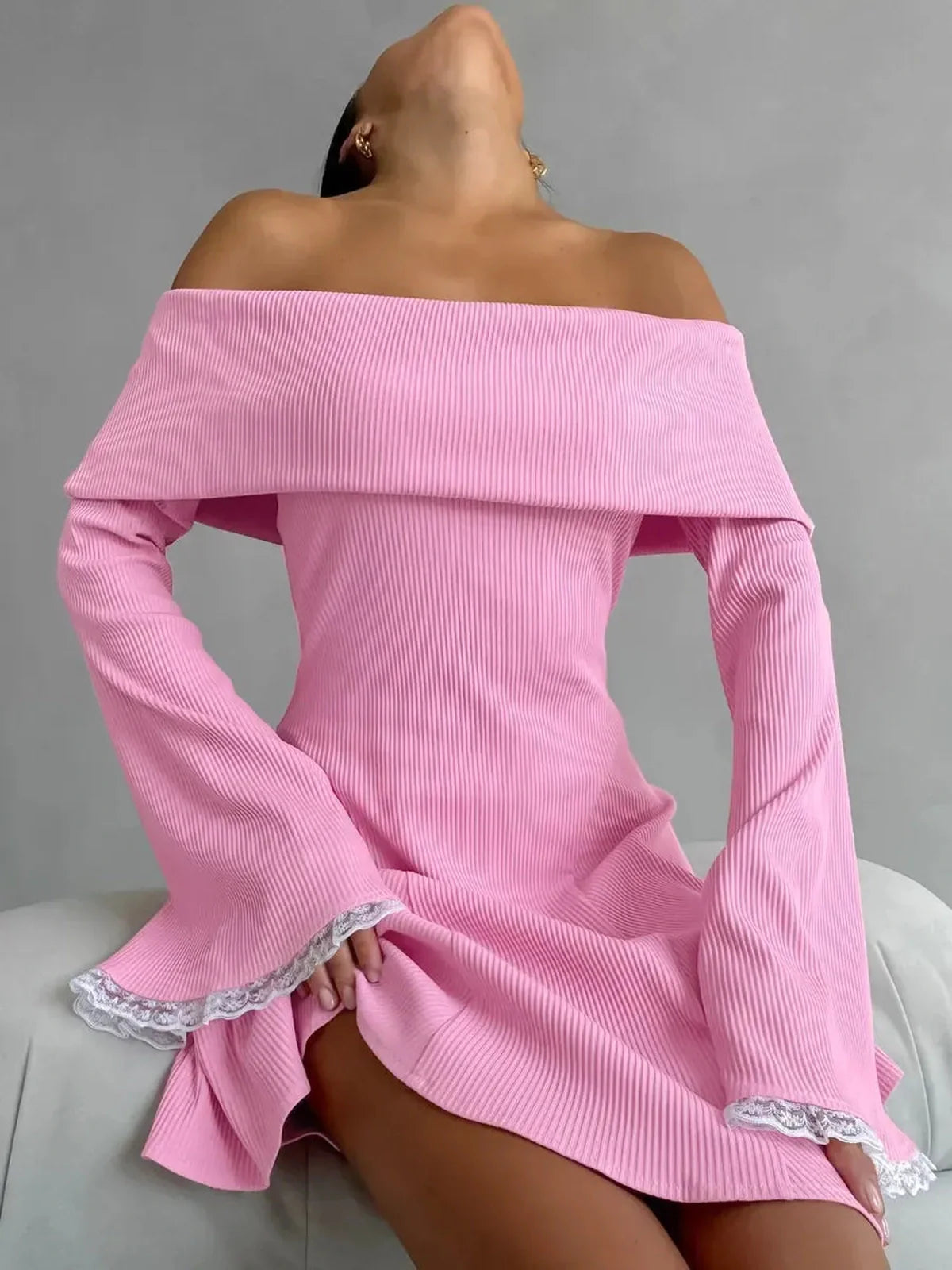 Blush Belle Mini Dress: Off-shoulder pink dress with flared lace cuffs, perfect for summer events and weddings.